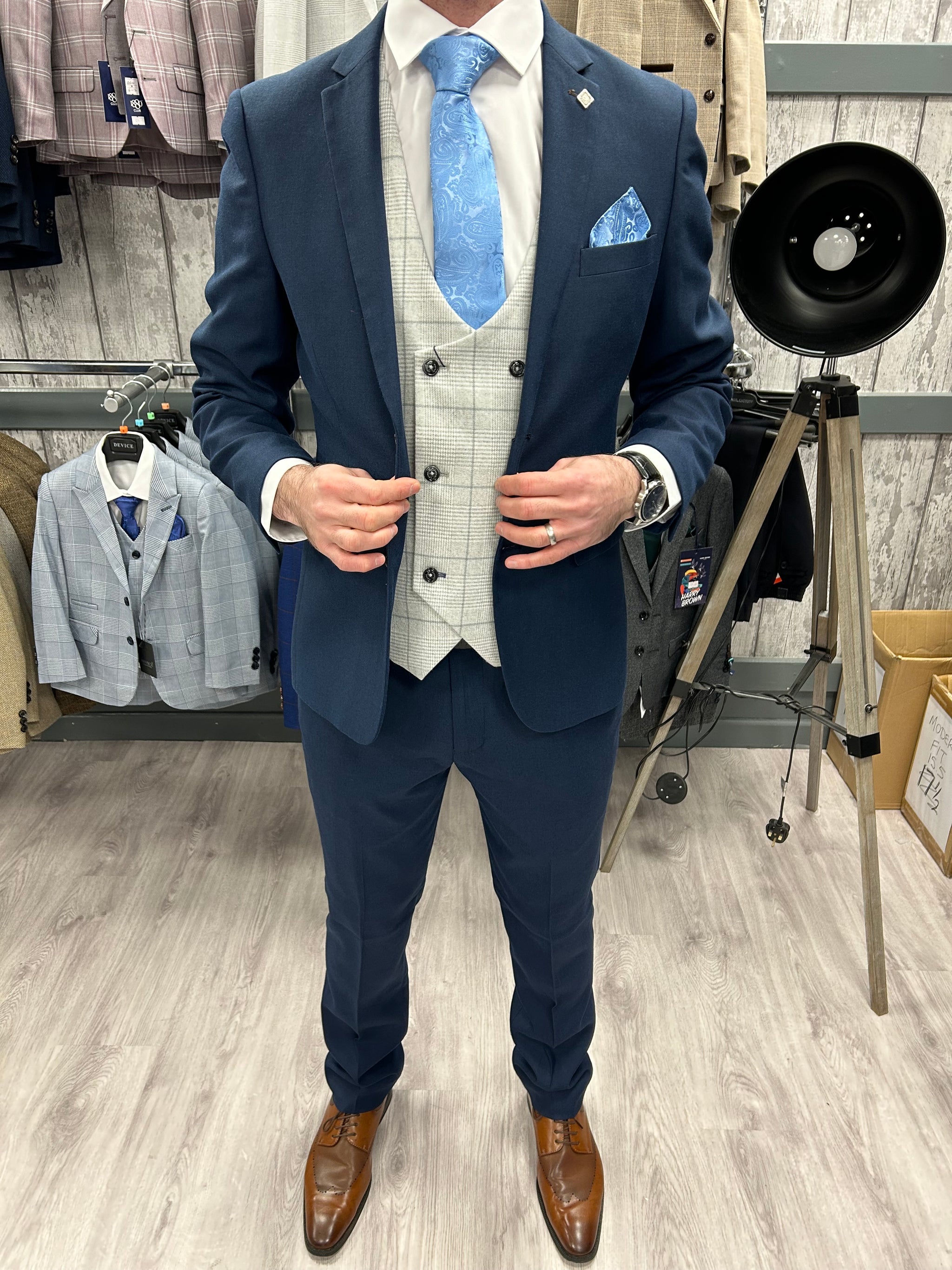 Calvin navy piece with radika light grey waistcoat suit for hire
